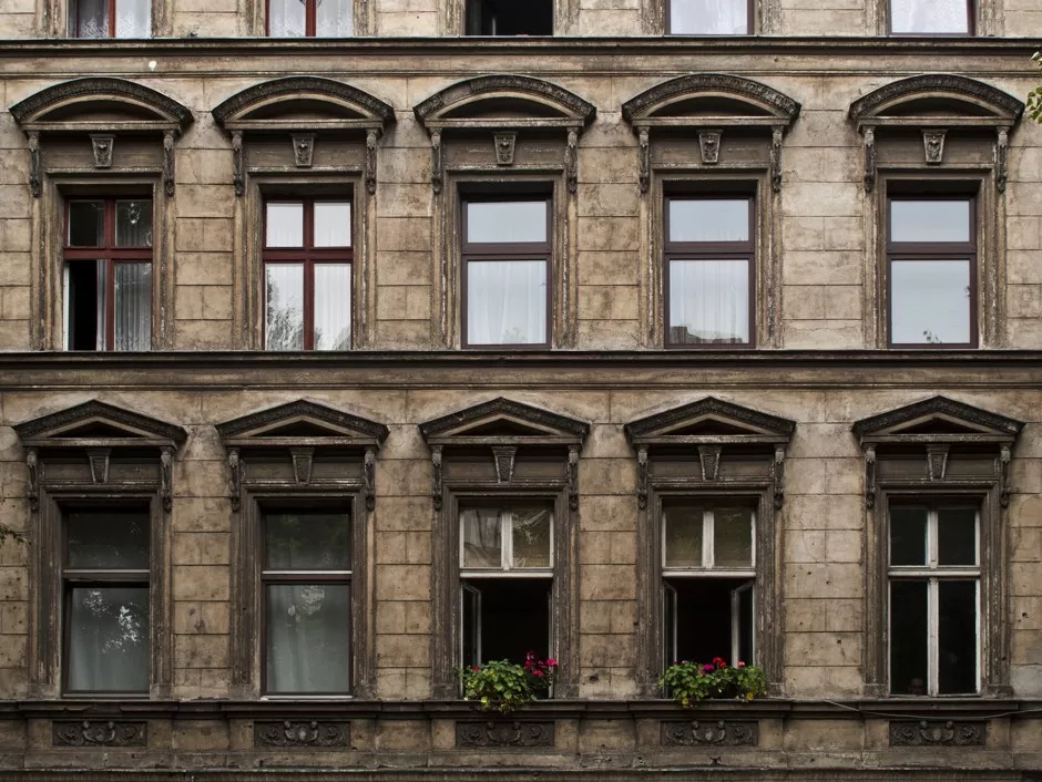 Prime Real Estate building with balconies and windows in Berlin.