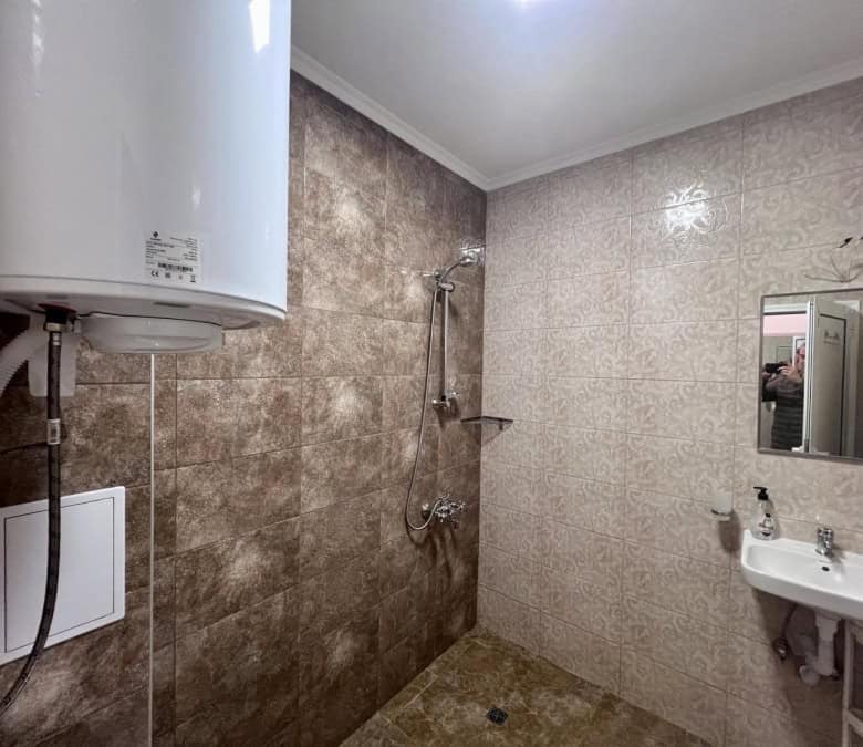 Modern studio bathroom with shower area in Magnolia Residence 5, Sunny Beach.