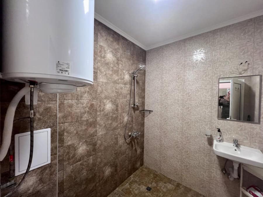 Modern studio bathroom with shower area in Magnolia Residence 5, Sunny Beach.