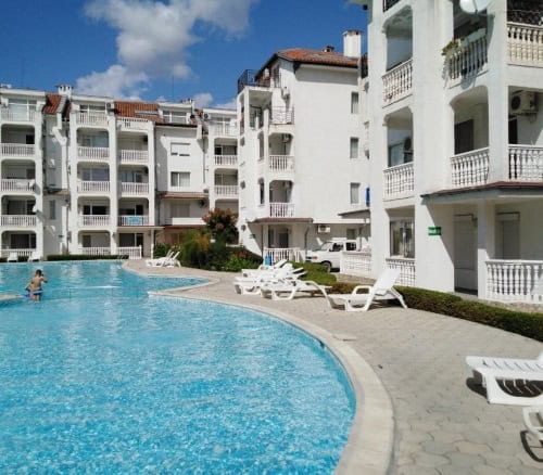 Pool view modern apartment in Sunny Beach, Bulgaria, featuring a spacious swimming pool and contempo.