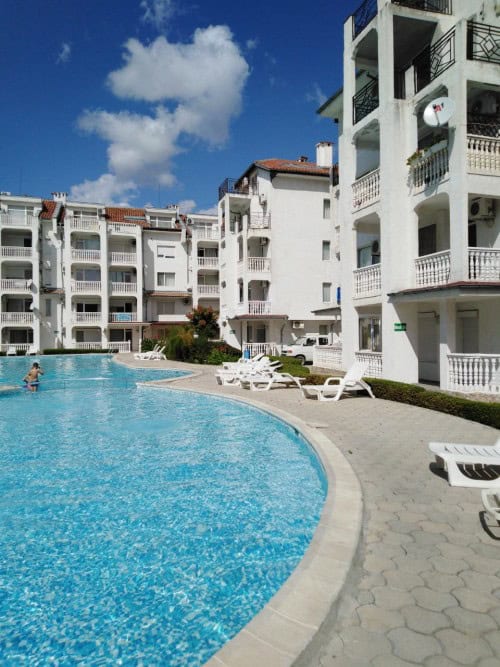 Pool view modern apartment in Sunny Beach, Bulgaria, featuring a spacious swimming pool and contempo.